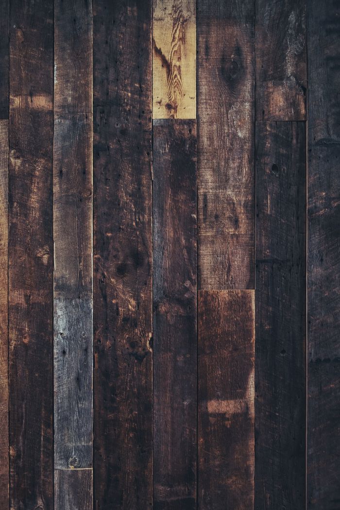 Vertical shot of rustic wooden planks, perfect for natural backgrounds.
